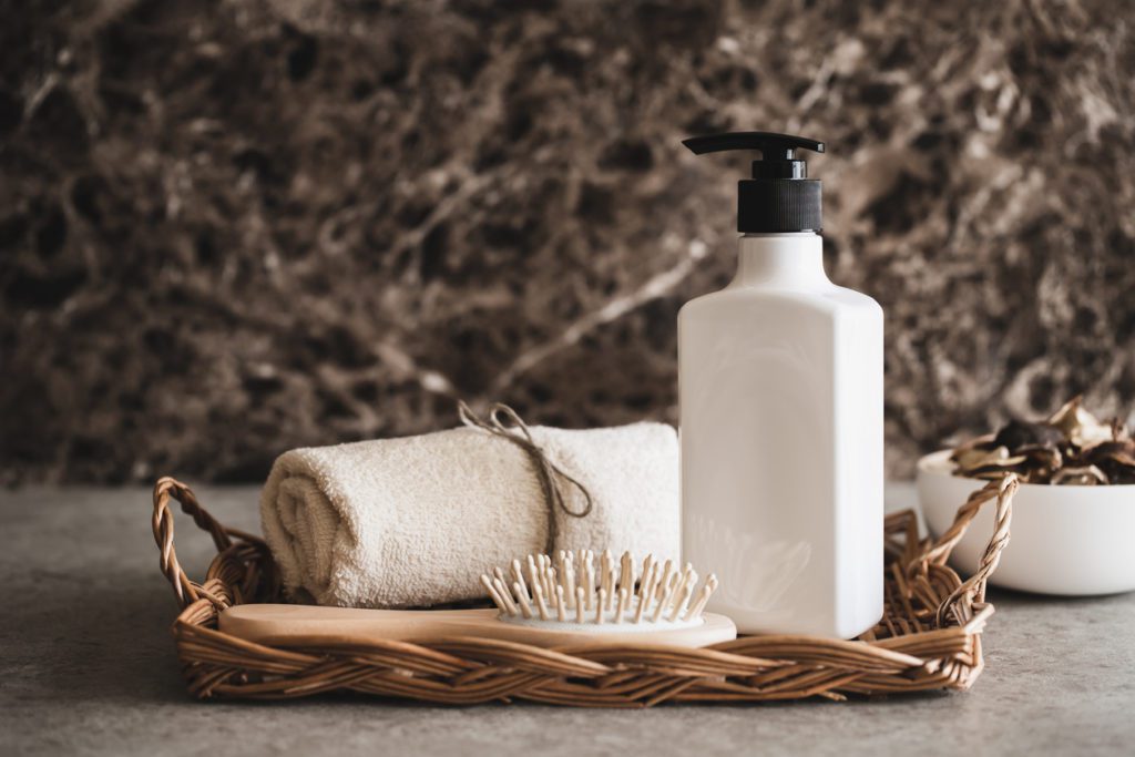 Shampoo, towel and hairbrush minimalist brand example