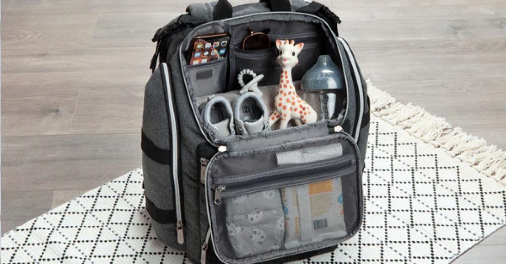 A grey backpack full of Baby products