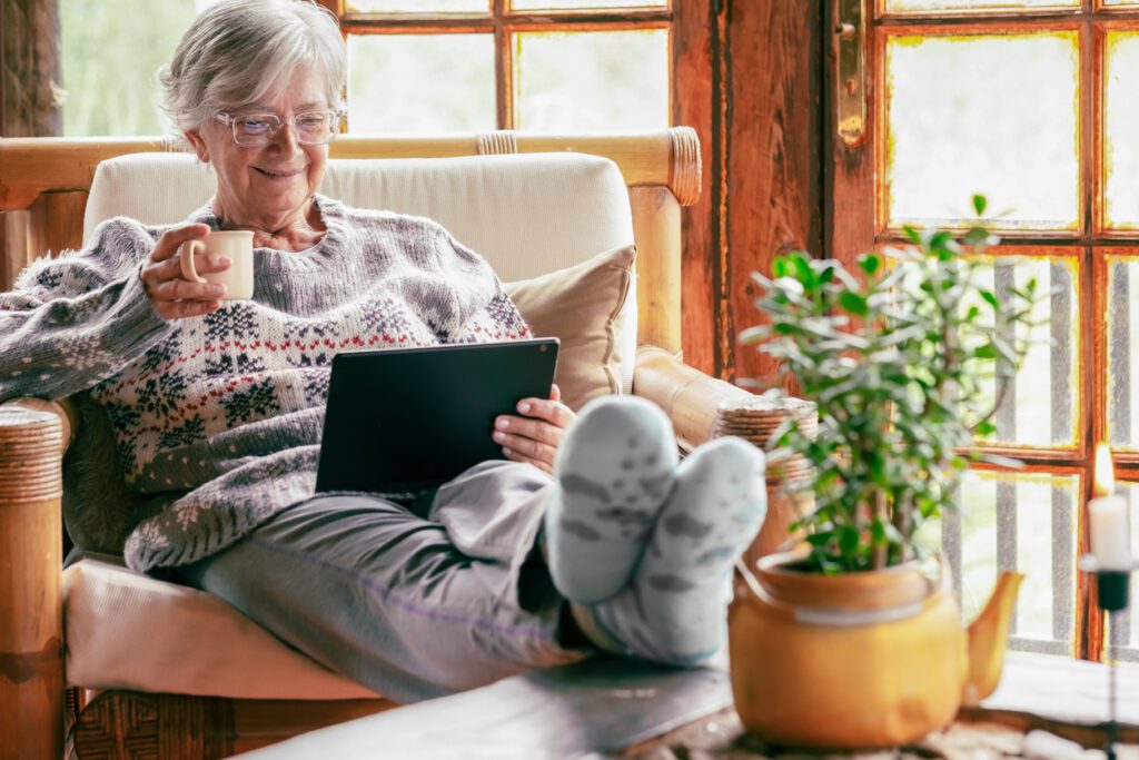Elderly person using a tablet device