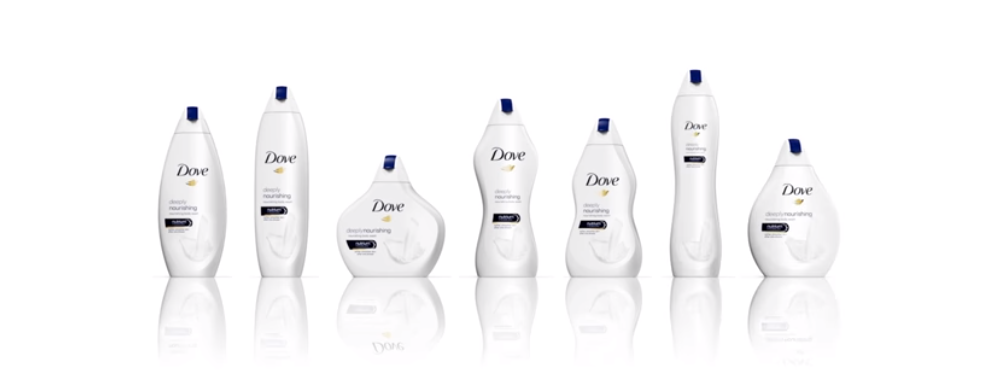 Dove shampoo bottles in a line with their brand name and logo facing outward