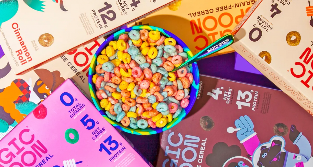 Magic Spoon colorful cereal in a bowl on cereal boxes