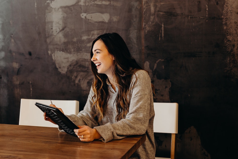 A women analyzing survey results on a tablet