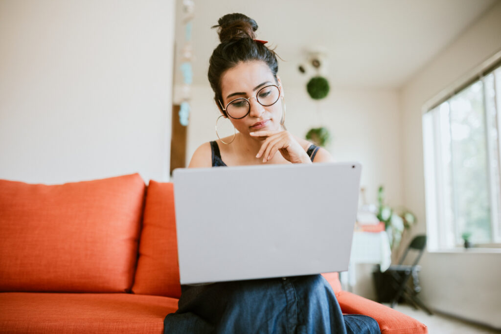 Woman working on her laptop doing qualitative research