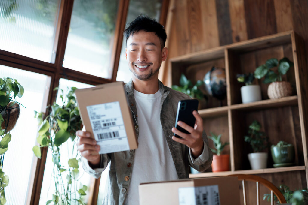 An image of a man holding a product box follows up a list of consumer behavior survey questions for price sensitivity