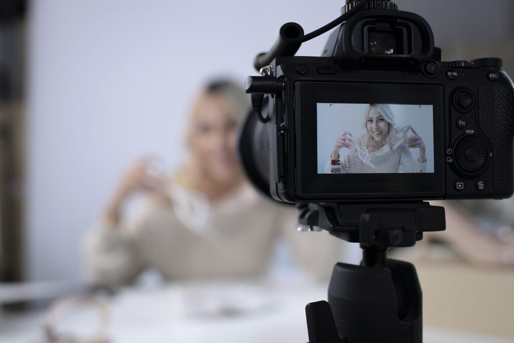 Image of a photoshoot for a company that is marketing a new product with an influencer