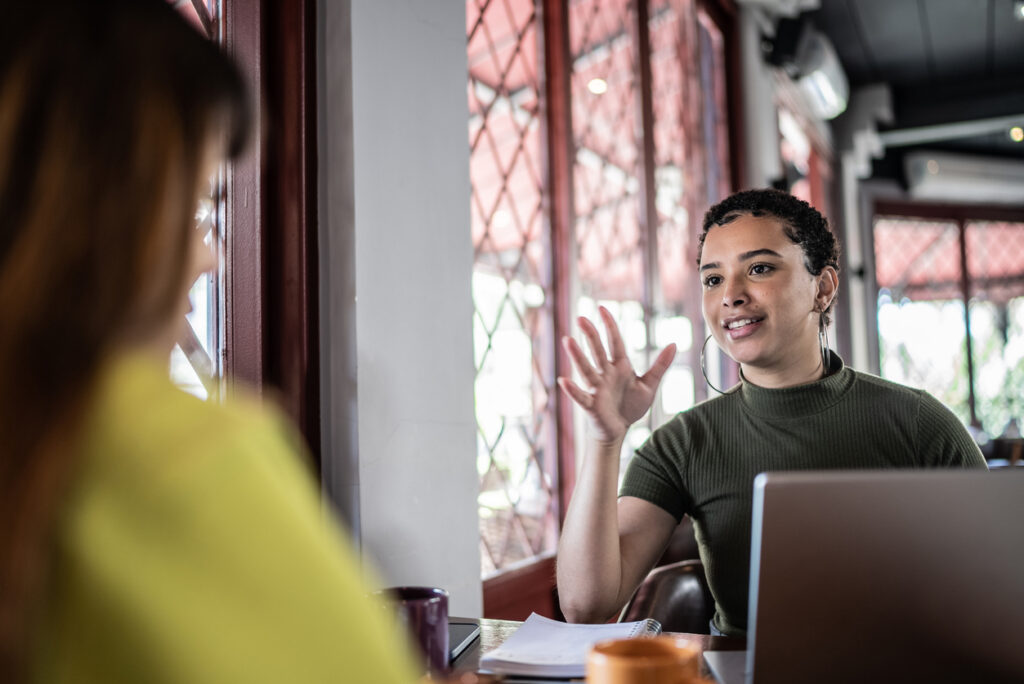 Woman asking market research questions to a respondent