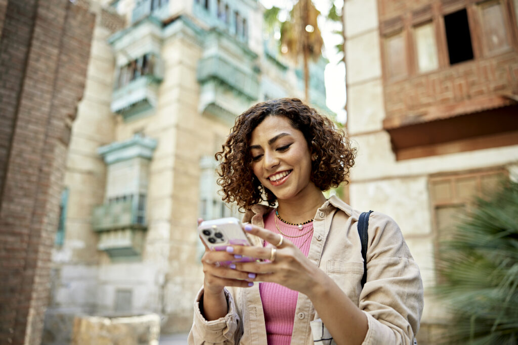Person completing survey on their phone