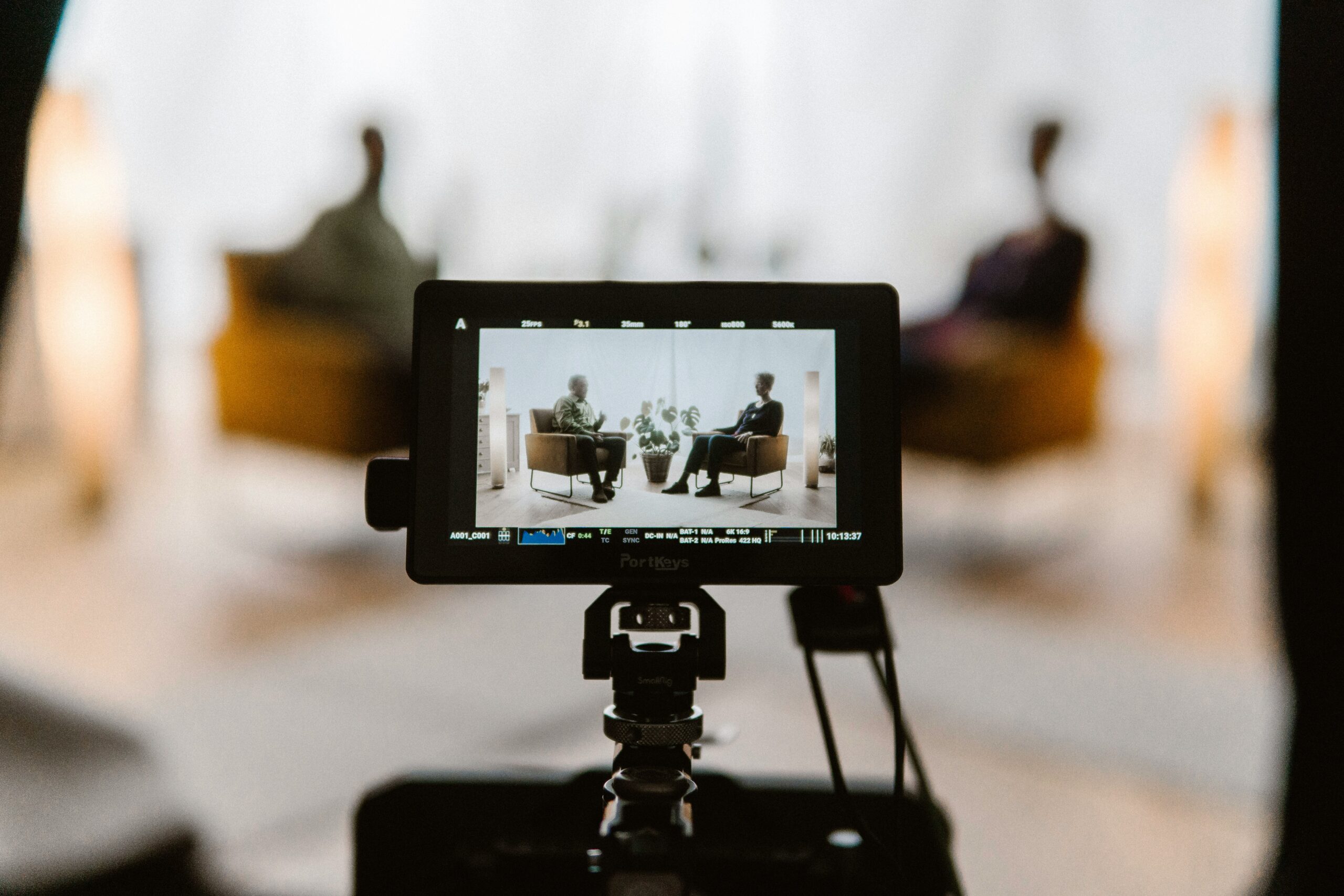 A camera screen showing two people doing a qualitative research interview 